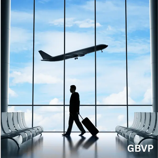 Private chauffeur welcoming travelers at Paris airport with luxury vehicle